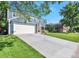 Lovely home featuring a spacious driveway, attached garage, and lush green lawn on a sunny day at 4643 S Vivian Ct, Morrison, CO 80465