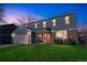 Charming two-story home with a manicured lawn, attached garage, and inviting front porch at 4643 S Vivian Ct, Morrison, CO 80465