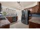 Modern kitchen with stainless steel appliances, granite countertops, and tile backsplash at 4643 S Vivian Ct, Morrison, CO 80465