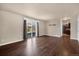Hardwood floors, natural light streaming through sliding glass doors in an inviting living room at 4643 S Vivian Ct, Morrison, CO 80465
