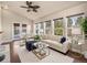 Bright living room featuring vaulted ceilings, large windows, and an adjacent dining area at 4643 S Vivian Ct, Morrison, CO 80465