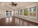 Open sunroom featuring vaulted ceilings, large windows, and hardwood flooring at 4643 S Vivian Ct, Morrison, CO 80465