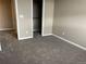 Comfortable bedroom with neutral walls, soft carpet, and a convenient closet at 4280 E Warren Ave # 2, Denver, CO 80222