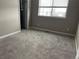 Cozy bedroom with plush carpet and a window offering natural light at 4280 E Warren Ave # 2, Denver, CO 80222