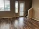 Well-lit living room features hardwood floors and a back door at 4280 E Warren Ave # 2, Denver, CO 80222