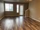 Well-lit living room with hardwood floors and access to the outside at 4280 E Warren Ave # 2, Denver, CO 80222