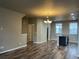 Open-concept living room with hardwood floors and plenty of natural light at 4280 E Warren Ave # 2, Denver, CO 80222