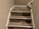Stairway featuring wood-look flooring and white trim leading to upper level at 4280 E Warren Ave # 2, Denver, CO 80222