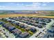 New residential community featuring modern homes, green spaces, and convenient access to nearby amenities under a bright blue sky at 17935 E 94Th Ave, Commerce City, CO 80022