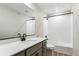 Bathroom featuring modern fixtures, and a vanity sink at 17935 E 94Th Ave, Commerce City, CO 80022
