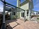 Backyard featuring a brick patio, pergola, and the home's light-green exterior, creating an inviting outdoor space at 5432 S Cathay Way, Centennial, CO 80015