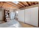 Unfinished basement with storage cabinets and open space, offering potential for customization and organization at 5432 S Cathay Way, Centennial, CO 80015