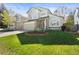 Charming two-story home with a well-manicured lawn, stone accents, and a two-car garage at 5432 S Cathay Way, Centennial, CO 80015