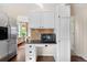 Charming kitchen featuring granite countertops, wooden floors, and white cabinets at 5432 S Cathay Way, Centennial, CO 80015