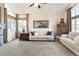 Cozy living room with neutral tones, large windows, and comfortable seating arrangements at 5432 S Cathay Way, Centennial, CO 80015