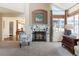 Bright living room featuring a fireplace, natural light, and an open floor plan at 5432 S Cathay Way, Centennial, CO 80015