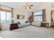 Cozy living room with neutral tones, large windows, and comfortable seating arrangements at 5432 S Cathay Way, Centennial, CO 80015