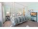Inviting primary bedroom featuring a four-poster bed, soft colors, and ample natural light at 5432 S Cathay Way, Centennial, CO 80015