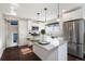 Modern kitchen with stainless steel appliances and a large island at 2930 N Fillmore St, Denver, CO 80205