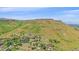 Scenic aerial view of a neighborhood nestled at the foot of a majestic mountain at 17313 W 43Rd Dr, Golden, CO 80403