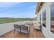 Outdoor balcony with a fire pit, seating, and panoramic views at 17313 W 43Rd Dr, Golden, CO 80403