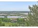 A scenic view of the Denver skyline surrounded by lush greenery at 17313 W 43Rd Dr, Golden, CO 80403