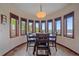 Charming dining area with a view features a modern light fixture and lots of natural light at 17313 W 43Rd Dr, Golden, CO 80403