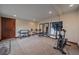 Home gym featuring carpet flooring, weights, and exercise bike, ready to promote a healthy lifestyle at 17313 W 43Rd Dr, Golden, CO 80403