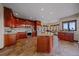 Gourmet kitchen features custom cabinetry, granite countertops, stainless steel appliances, and a breakfast nook at 17313 W 43Rd Dr, Golden, CO 80403