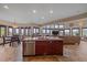 Well-appointed kitchen island with stainless dishwasher, granite countertops, and open layout at 17313 W 43Rd Dr, Golden, CO 80403