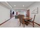 Cozy living area with fireplace and TV, adjacent to dining area at 17313 W 43Rd Dr, Golden, CO 80403