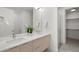 Modern bathroom featuring double sinks, sleek countertops, and a glass-enclosed shower for a spa-like experience at 1815 N Williams St, Denver, CO 80218