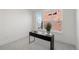 Bright bedroom with a desk, a large window, and a plant on the desk at 1815 N Williams St, Denver, CO 80218
