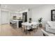 Open-concept dining area with modern decor and seating for six at 1815 N Williams St, Denver, CO 80218