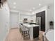 Bright kitchen featuring a center island with bar seating, stainless appliances and lots of light at 1815 N Williams St, Denver, CO 80218