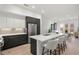 Open-concept kitchen with large island, modern appliances, and access to the living area at 1815 N Williams St, Denver, CO 80218
