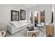 Beautifully decorated living room with modern furniture, stylish art, and ample natural light at 1815 N Williams St, Denver, CO 80218