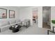 Living room features contemporary decor, a gray sofa, and natural light at 1815 N Williams St, Denver, CO 80218