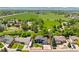 Aerial view of home location showcasing lush greenbelt and neighboring mature trees at 7325 Taft Ct, Arvada, CO 80005