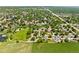 Community aerial view of the neighborhood with mature trees and proximity to community park and greenbelt at 7325 Taft Ct, Arvada, CO 80005