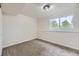 Neutral finished basement with large window with views of exterior trees at 7325 Taft Ct, Arvada, CO 80005
