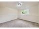 Neutral finished basement with large window with views of exterior trees at 7325 Taft Ct, Arvada, CO 80005