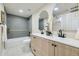 Bathroom featuring double vanity, tile flooring, tub and shower, and soft decor at 7325 Taft Ct, Arvada, CO 80005