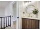 Bathroom with a decorative mirror and wood vanity at 7325 Taft Ct, Arvada, CO 80005