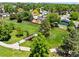 Park walking path with wooden bridge over stream with beautiful mature trees and landscaping at 7325 Taft Ct, Arvada, CO 80005