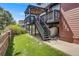 Multi-level deck and backyard with lush green lawn at 13324 W 86Th Dr, Arvada, CO 80005