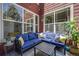 Outdoor patio with blue cushioned sofa, coffee table, and views at 13324 W 86Th Dr, Arvada, CO 80005