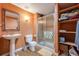 Bathroom featuring walk-in shower, vanity and linen closet at 13324 W 86Th Dr, Arvada, CO 80005