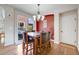 Cozy dining room with hardwood floors, a chandelier, and sliding glass doors at 13324 W 86Th Dr, Arvada, CO 80005