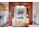 Cozy kitchen equipped with a gas cooktop, light wood cabinets, and decorative pot rack evokes a welcoming atmosphere at 13324 W 86Th Dr, Arvada, CO 80005